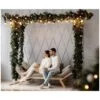 Charming young couple in cozy white home clothes poses in a room