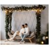 Charming young couple in cozy white home clothes poses in a room