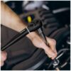 Repair man making car service
