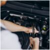 Repair man making car service